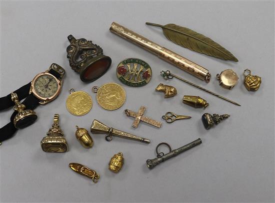 A 20 Franc gold coin and a 5 Franc gold coin (both with pendant mounts) and sundry items including gold charms.